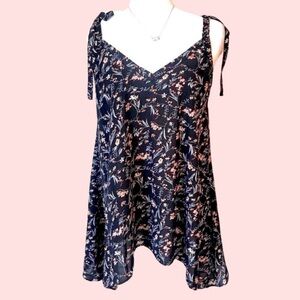 BOUTIQUE ITEM- FLORAL BLACK TANK TOP WITH SHARK BITE HEM